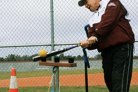 Lou Reale showed clinic-takers how it’s done, using one of his inventions, a batting T set up for pitches over the middle and over the outside and inside corners of the plate.