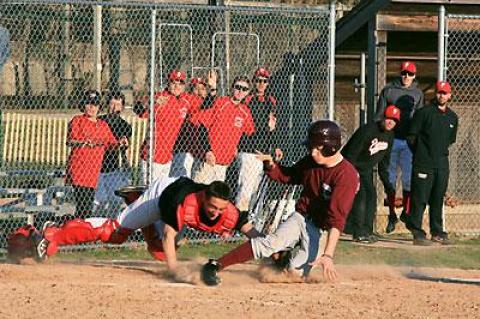 The umpire ruled that East Hampton’s Riley McMahon was out at the plate following a long fly ball hit to Colman Vila, Pierson’s left fielder, by Deilyn Guzman during a recent scrimmage at Sag Harbor’s Mashashimuet Park. The Whalers’ catcher, Paul Dorego, made the diving tag.