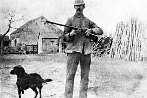 A.E. Sherrill, pictured with his dog, in an undated photo at the Sherrill Farm.