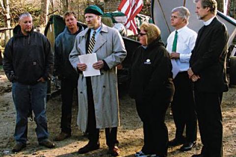 Daniel G. Rogers, center, announced his request that Gov. Andrew Cuomo investigate the D.E.C.’s enforcement policy during a press conference in East Hampton on Monday afternoon.