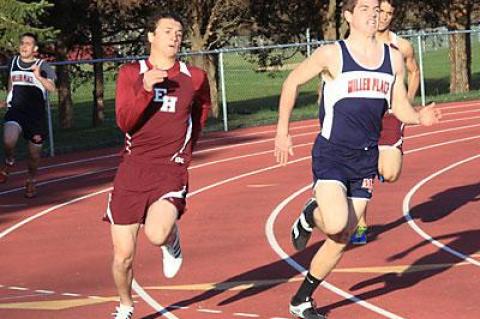 Chris Reich, who coaches the East Hampton High School boys track team, was happy to have Hunter Kelsey, at left, on his way to winning the 200 in the Miller Place meet, back in action.