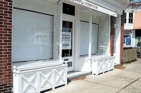 Vacant stores like this one will be required to put a display in the window if a new law in East Hampton Village is passed.