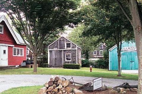 The Southampton Historical Museum’s blacksmith shop, seen here in 2009, was destroyed last summer and has been in the process of being rebuilt since Halloween. The images below show how it looked in its original location around 1880, and at the museum property in 2000 and today.