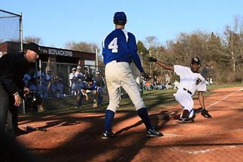 Deilyn Guzman, sliding home above in the Glenn game, and his teammates were 2-3 going into this week’s three-game series with Amityville.