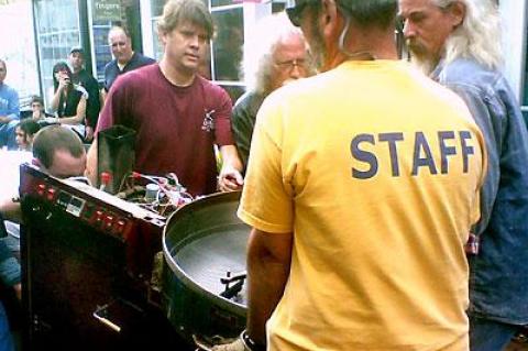 Customers and friends helped Andres Bedini, center, move Java Nation’s roaster out of the retail space the coffee shop has occupied for over 17 years.