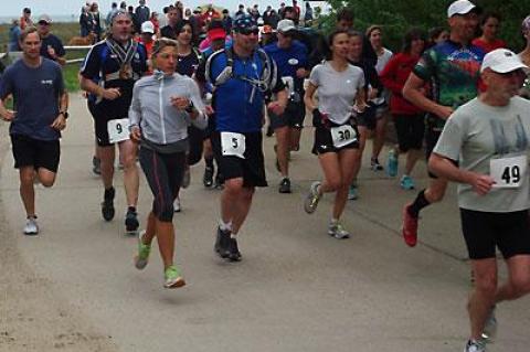 The half-marathon’s competitors soon were off the road and into the woods.