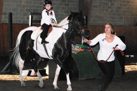 Hope Hamilton, 8, trotted on Kirolak, led by Jessie Bihlmaier.