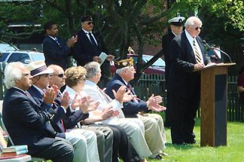 Retired Navy Capt. William T. Brown delivered the keynote address at the Hook Mill green following the parade.