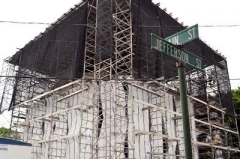 The John Jermain Memorial Library in Sag Harbor, built in 1910, has been wrapped up tight for a long-delayed restoration.