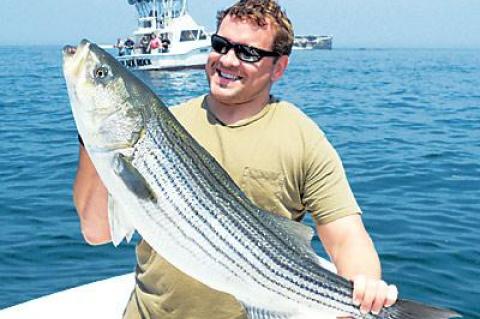 Mike Tuscano of Amagansett hefted a fat striped bass he caught while light-tackling with Capt. Ken Rafferty near Big Gull Island a week ago.