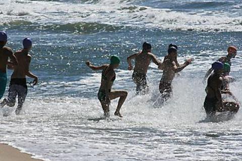 The surf wasn’t rough, but the water was cold, and the low tide lengthened carries up the beach.