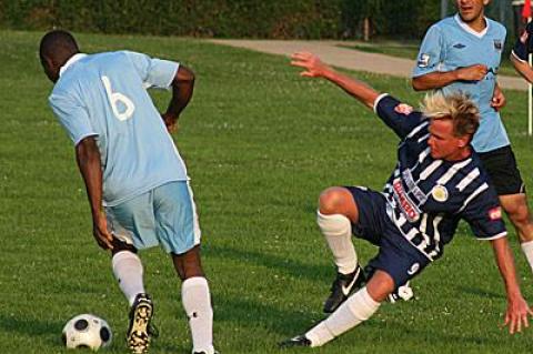 Playoff-bound Bateman Painting, whose Winston Reid (6) headed goalward as Jeff Esposito tumbled to the turf, shut out Espo’s 4-0 on June 20.