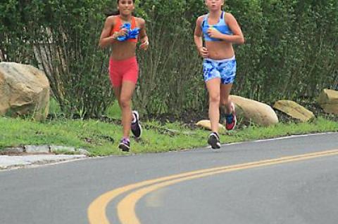 Two young up-and-comers, Liana Paradiso and Maggie Purcell, have yet to learn how to run the hills.