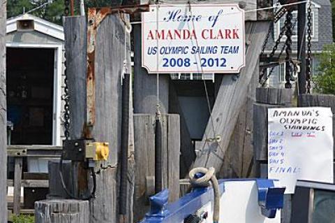 A sign supporting their effort is at the South Ferry dock on Shelter Island.