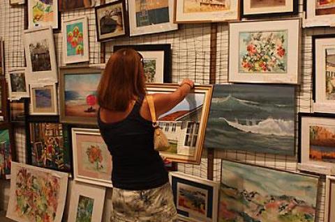 The heat and humidity on Saturday did not dampen enthusiasm for Guild Hall’s 66th annual Clothesline Art Sale, which was held both inside in air-conditioned comfort and outside on the museum’s lawn.