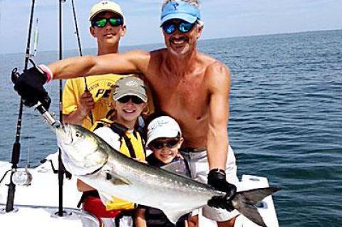 Emma Zuccotti, center, wrestled this monster bluefish out of Gardiner’s Bay over the weekend.