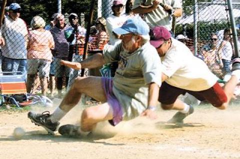 Ed Hollander, a gritty landscape architect, took one for the team as he kicked the ball out of Lee Minetree’s glove to bring the Artists to within 12-11 in the bottom of the 10th.