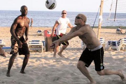 Kofi Sekyiamah and Todd Carberry looked on as Jessie Libath laid the ball up during last Thursday’s semifinal between the Beach Diplomats and Team Dempsey at Gurney’s Inn.