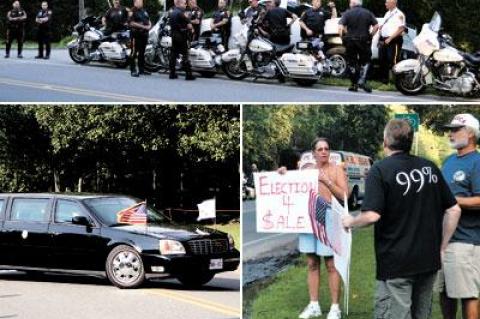 During Vice President Joe Biden’s fund-raising visit to Bridgehampton Friday, top, Suffolk County police secured the site, while an Occupy protester’s flag was displayed upside-down.