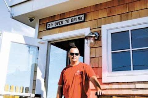 Robert Anderson, head of security at the Sloppy Tuna in Montauk, has a view of the ocean from his post at the club’s entrance.