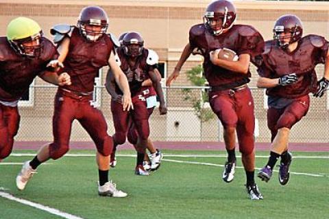 The Bonackers, seen above in a recent preseason practice, are switching to a triple-option “flex” offense this year.