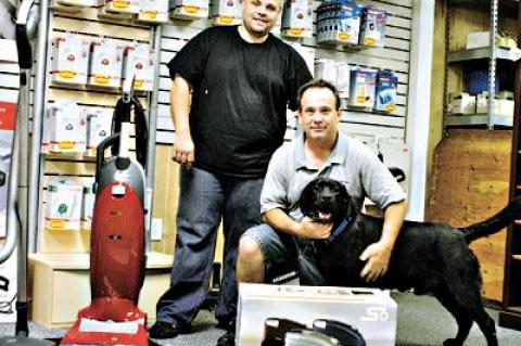 East Hampton Vacuums is one of the last great fix-it shops around, said Martin O’Brien, right, who owns the business. His nephew Chris Pond, left, is the manager.