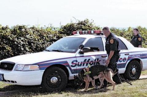 At Hartman’s Briney Breezes Motel in Montauk, where George Richardson was staying before he disappeared on Aug. 28. Suffolk police dogs and their handlers searched a wooded area near the motel yesterday.