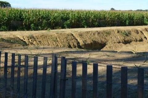 To create drainage to alleviate flooding, the town had agricultural soil removed from protected county farmland.