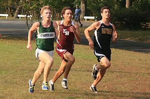 Bracketed by Westhampton Beach’s Graham Brown and Sayville’s Kiernan Harrison, Adam Cebulski headed for the finish.