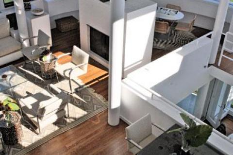 A view of the living room, with hollow steel columns supporting the house.