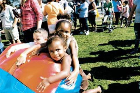 Liliana and Isabella Hopson got a bit impatient waiting their turn for an inflatable slide at the Montauk Chamber of Commerce fall festival on Saturday.