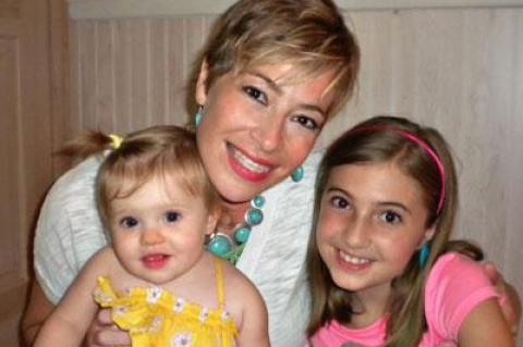 Cheryl Bennett of East Hampton, the mother of Sophia, 1, and Jenna, 9, is experiencing financial difficulties while being treated for breast cancer.