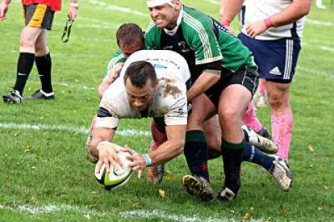 Gordon Trotter, about to touch the ball down in Bayonne’s try zone above, and his teammates overwhelmed the side from Jersey Saturday.