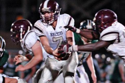 Cort Henevgeld, handing off to Andre Cherrington, above, gained 231 yards himself.