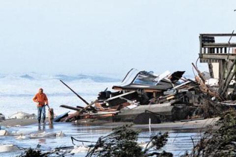 Only twisted debris remained Tuesday at one of Ronald Lauder’s Wainscott houses. The white bags had been placed to stave off ongoing erosion.