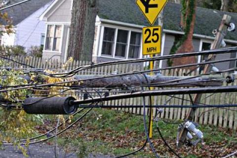 Toppled utility poles were common, knocking out electricity and, in some cases, telephone service, to thousands of people.