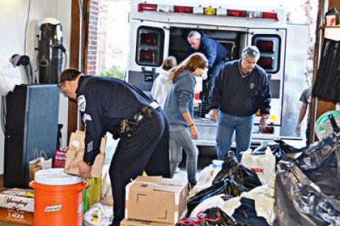 Sag Harbor Police Chief Tom Fabiano, right, helped load an ambulance with supplies collected from the community, and drove along with Ed Downes, president of Sag Harbor’s volunteer ambulance corps, to donate the ambulance to the Broad Channel Fire Department in Jamaica Bay, which lost its entire fleet.