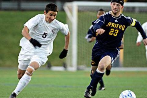 Nick West (5), who led East Hampton in scoring in the postseason, and his teammates were held in check by the Jayhawks.