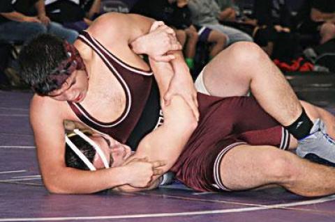 Axel Alanis, East Hampton’s 170-pounder, is only a freshman, but looked very good Saturday. Versus a Sayville senior, above, he almost erased a large deficit when he clamped on a headlock in the third period.