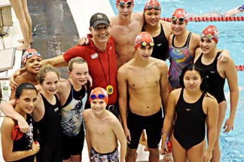 The Hurricanes had 12 finalists at Eisenhower Park, among them, from left, Liana Paradiso, Chasen Dubs, Cecelia de Havenon, Maggie Purcell, Ryan Duryea, Alex Astilean, Noelle Capone, and, at the rear with Tom Cohill, the coach, Thomas Brierley, Skye Marigold, Lilah Minetree, and Georgie Bogetti. Another finalist, Marikate Ryan, is not in the photo.