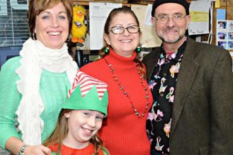 One Stop Pet Shop in Amagansett held its annual Santa Paws event on Sunday. Pictured from left are the shop’s Suzanne Bye, Haleigh, her daughter, Lisa Narizzano, and Mario Orlando.