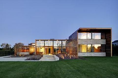 Mahogany boards and travertine marble define the house, both inside and out.