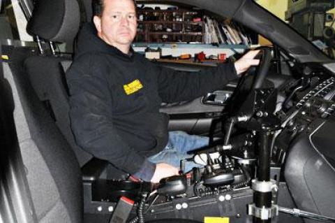 Tom Bono, a mechanic at the East Hampton Town garage, is in charge of wiring the console of the Ford Taurus Interceptor, the newest police vehicle in the department fleet.