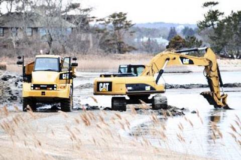 Workers excavated sand from Georgica Pond this week. Patrick Bistrian’s company has been granted sole access to the East Hampton Town Trustees’ 12,000-cubic-yard allotment.