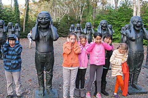 On a visit to the LongHouse Reserve in East Hampton this fall, young members of a nature club sponsored by Third House Nature Center posed with sculptures by Yue Min Jun.