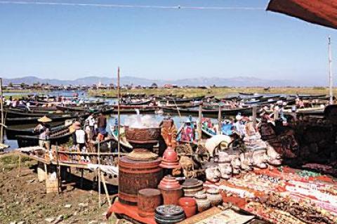 Laura Donnelly’s trip to Southeast Asia included stops at several markets (the floating market in Myanmar pictured above), temples, shrines, and other exotic locales.