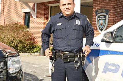 East Hampton Village Police Officer Julio Galeano, seen here when he was honored as the top cop for 2012, will have a hearing soon.