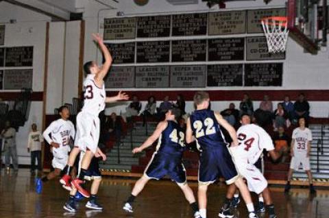 Thomas King, lofting a jump shot above, took the game over in the final minutes.