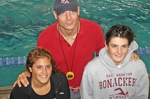 Tom Cohill, shown with Georgie Bogetti and Trevor Mott, was impressed by their long-distance performances at Lehman College this past weekend.