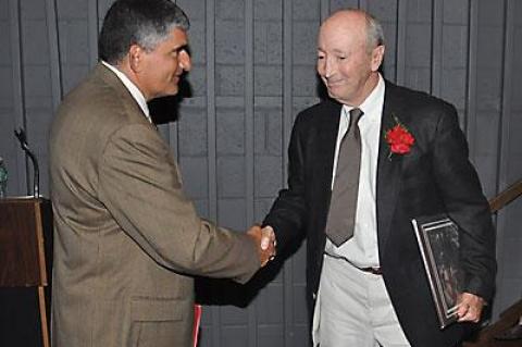 One of the inaugural Hall of Fame class’s inductees was Ed Petrie (at right, shaking hands with the athletic director, Joe Vas), the winningest public high school boys basketball coach in New York State.